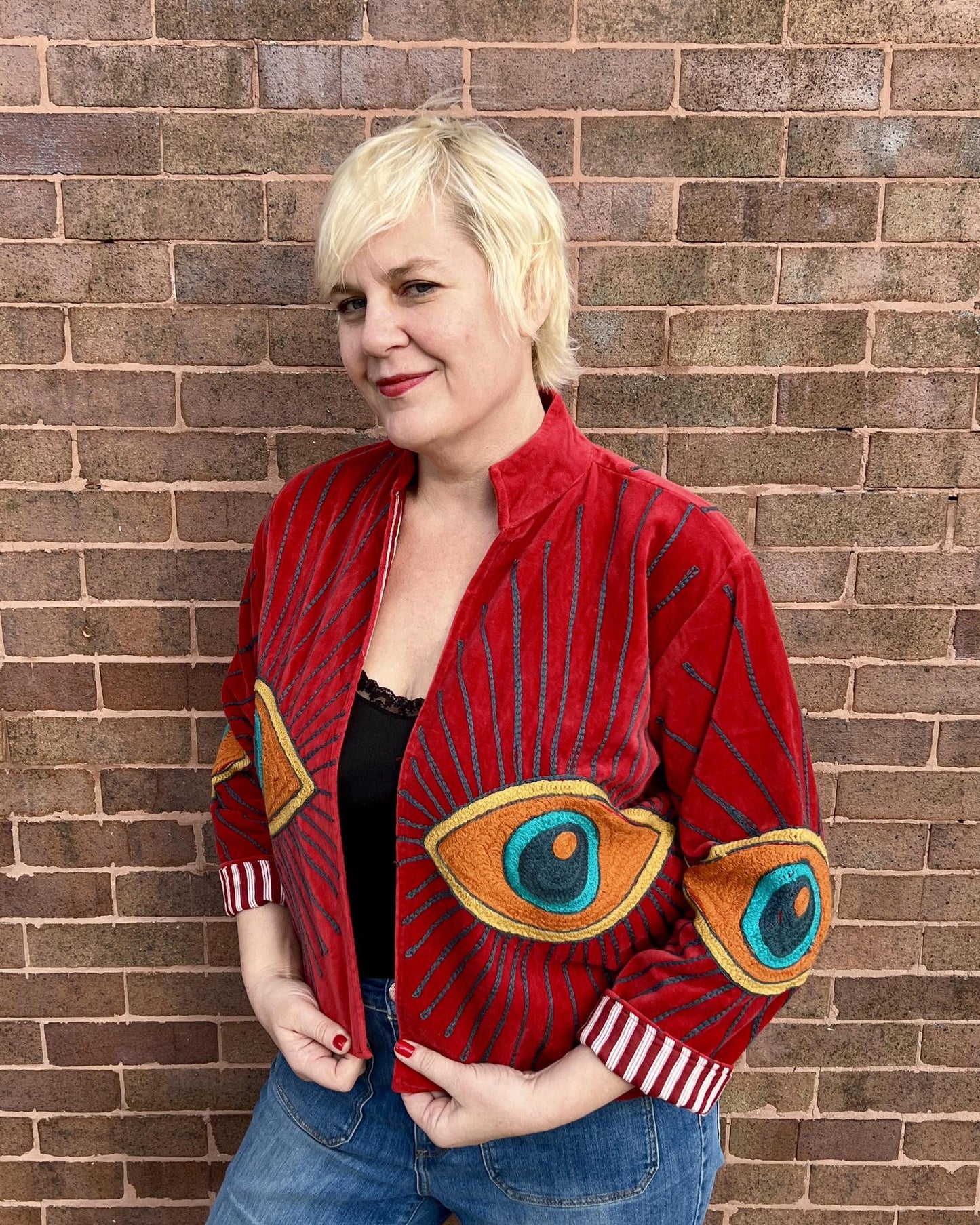Txtile Velvet Evil Eye Jacket in Cherry Red with Orange Eyes