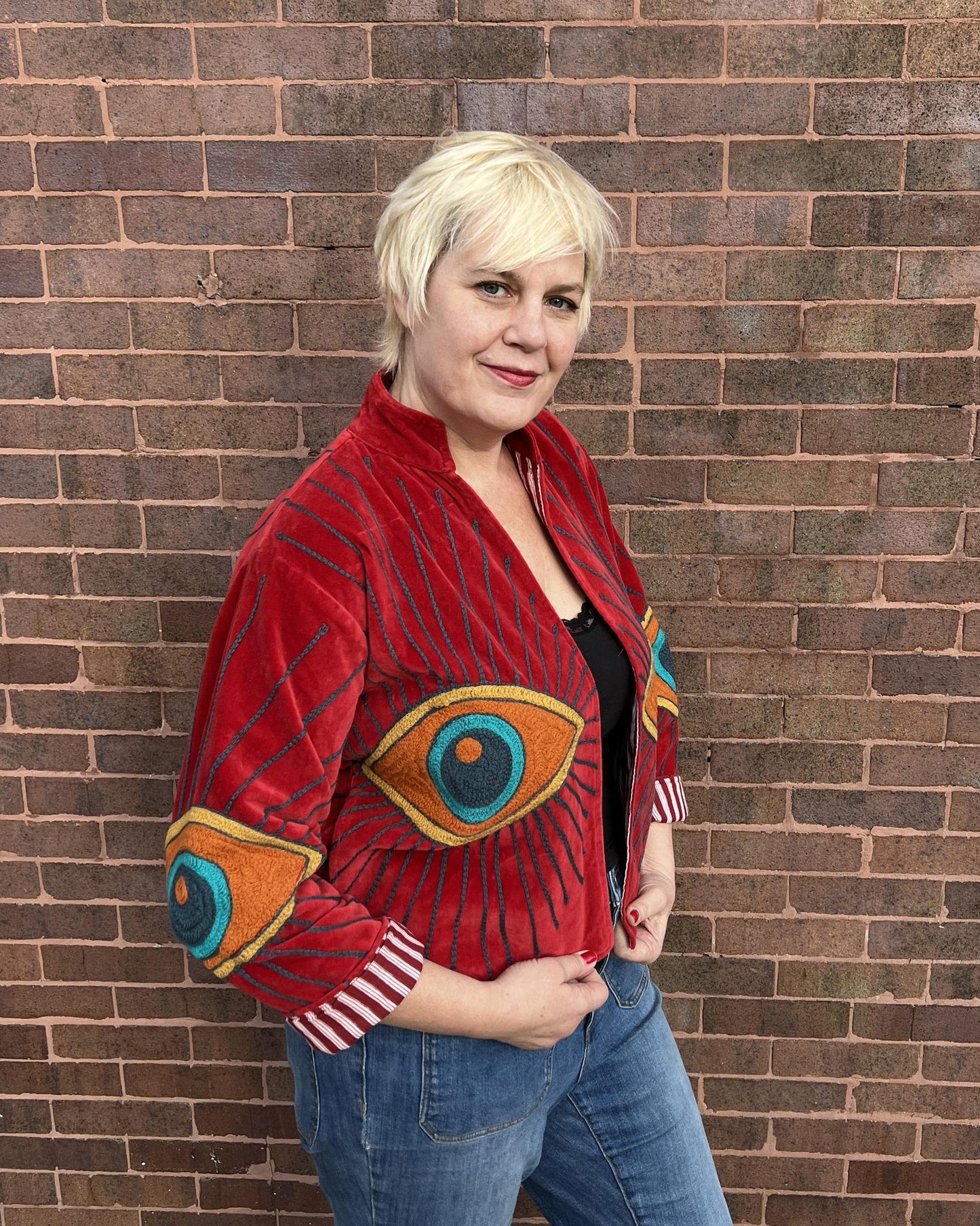 Txtile Velvet Evil Eye Jacket in Cherry Red with Orange Eyes