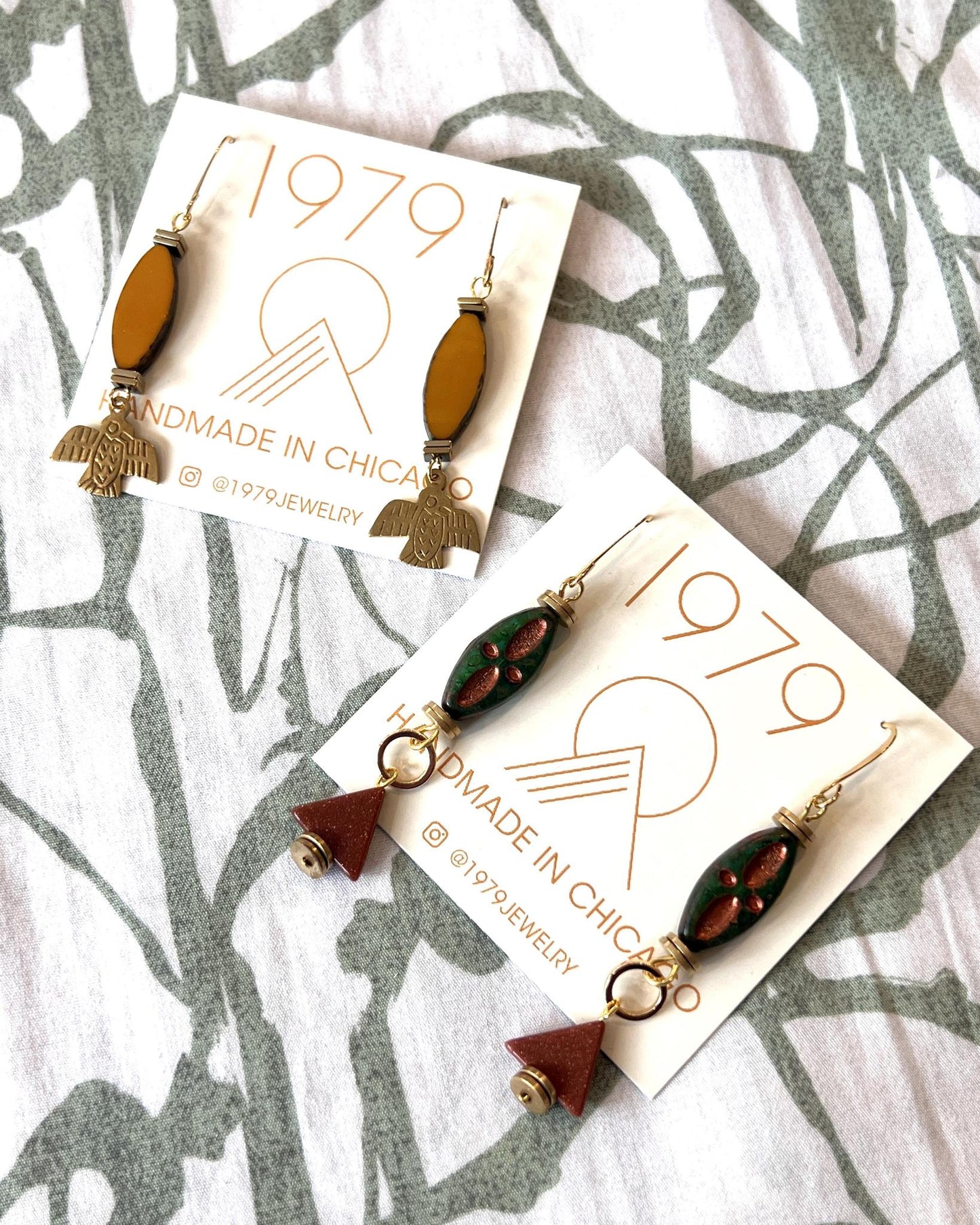 1979 Jewelry Brass Earrings Ochre Ovals and Thunderbirds Charms