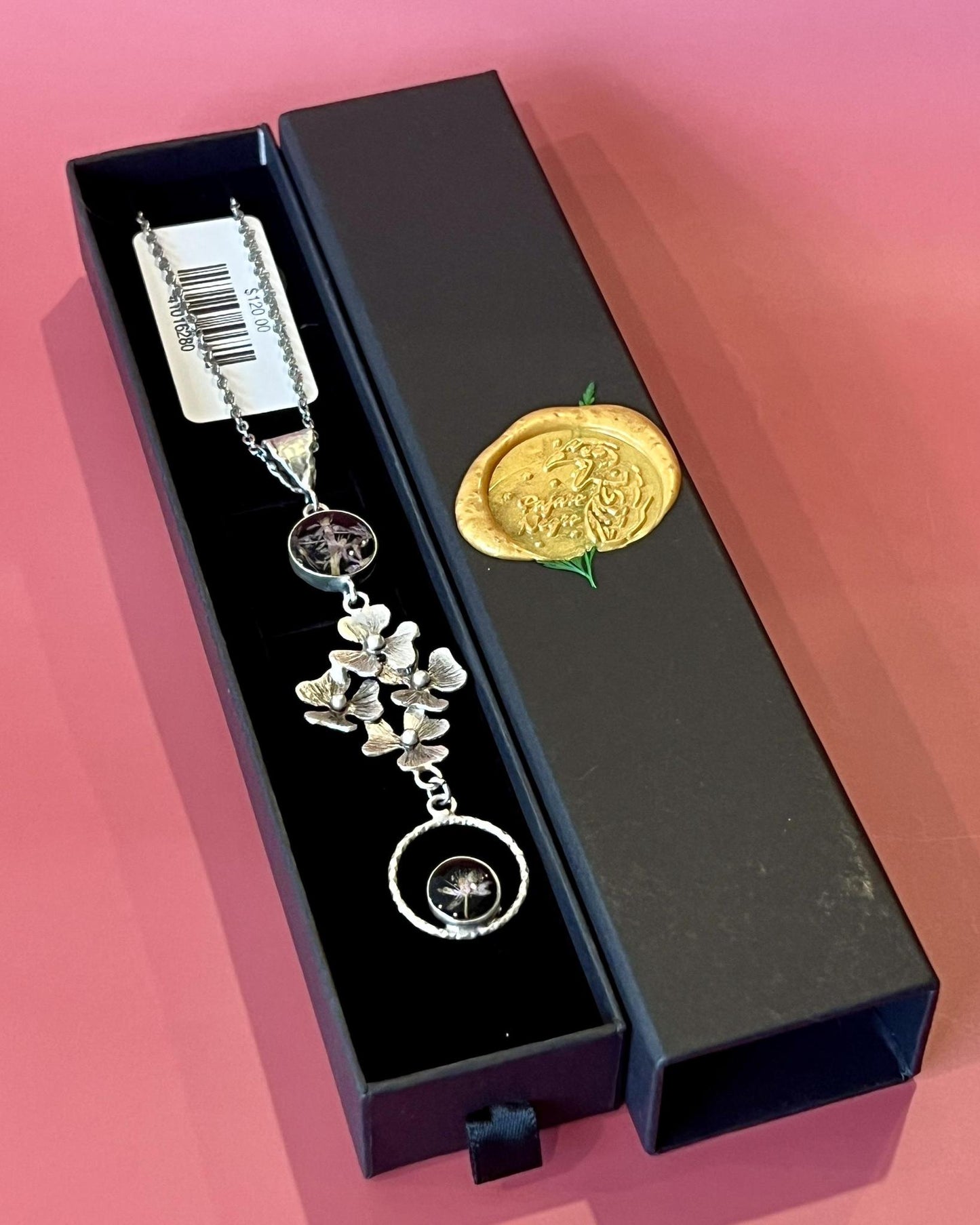 Pajaro Negro Floral Botanical Necklace in a Wax Sealed Box