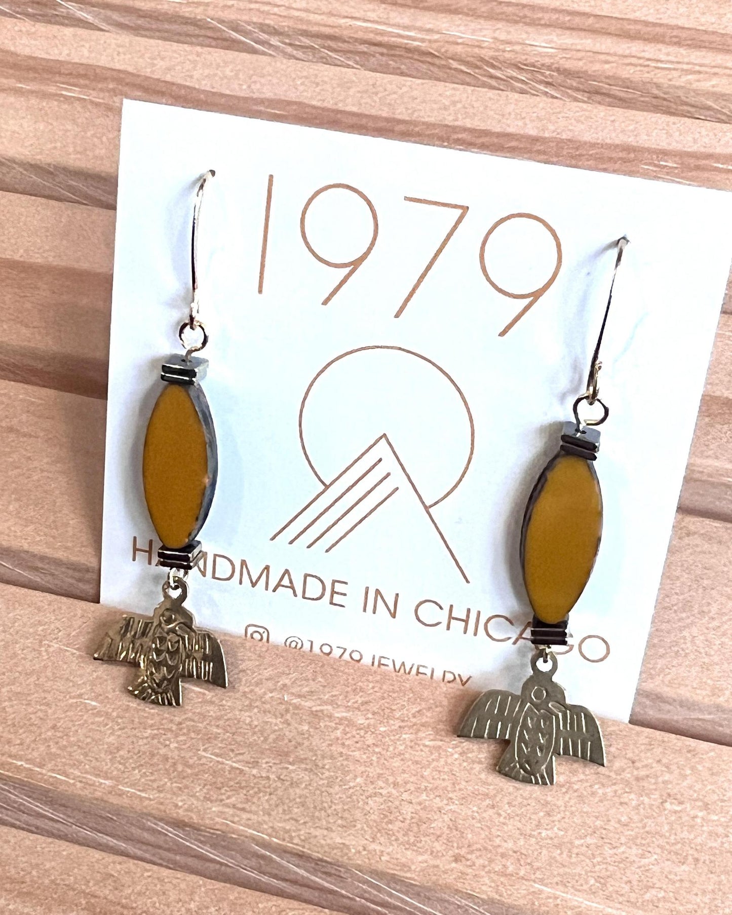 1979 Jewelry Brass Earrings Ochre Ovals and Thunderbirds Charms