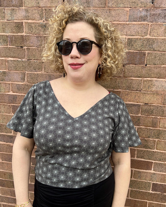 Squasht Bell Sleeve Ballet Top in Gray Starburst Print