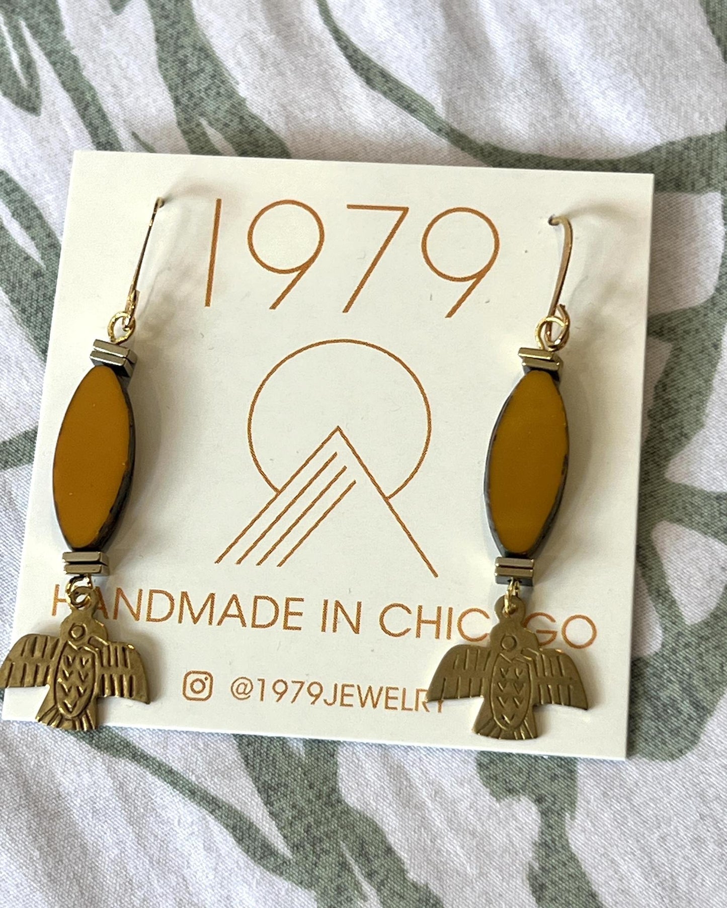 1979 Jewelry Brass Earrings Ochre Ovals and Thunderbirds Charms