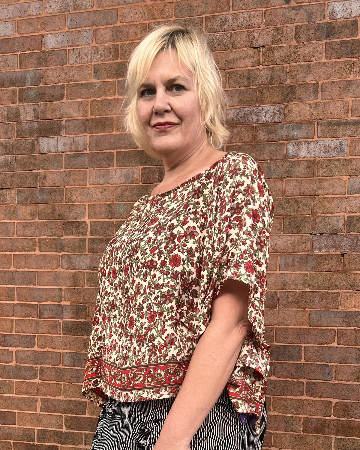 Indie Ella Tessa Flowy Silk Top in Cream with Red and Green Floral Vines Print